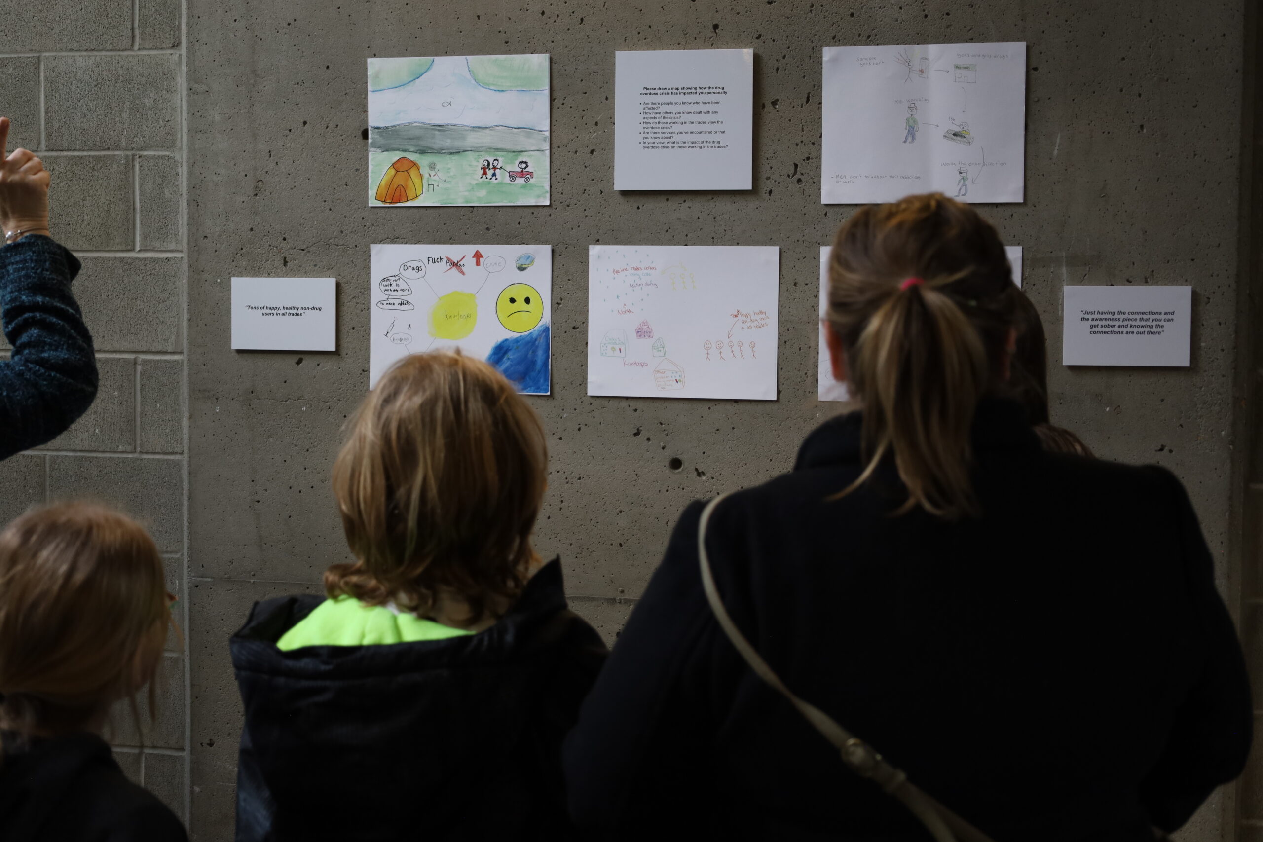 Attendees viewing maps showcased for the event